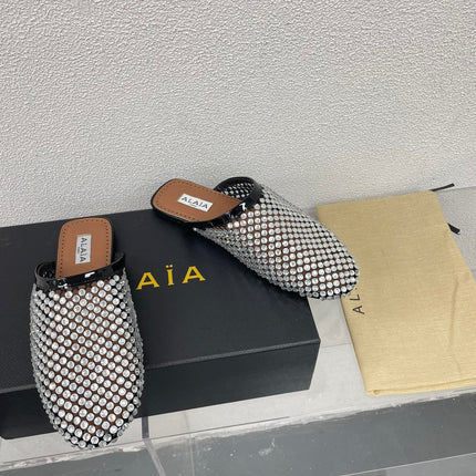 ALAIA FLAT MULES IN STRASS BLACK LAMBSKIN WITH RHINSTONES