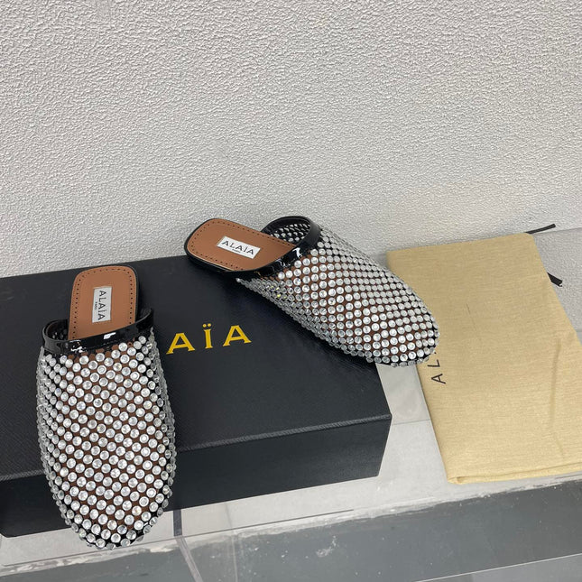 ALAIA FLAT MULES IN STRASS BLACK LAMBSKIN WITH RHINSTONES