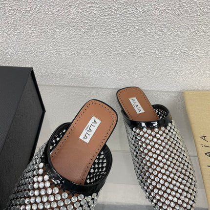 ALAIA FLAT MULES IN STRASS BLACK LAMBSKIN WITH RHINSTONES