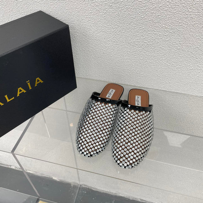 ALAIA FLAT MULES IN STRASS BLACK LAMBSKIN WITH RHINSTONES