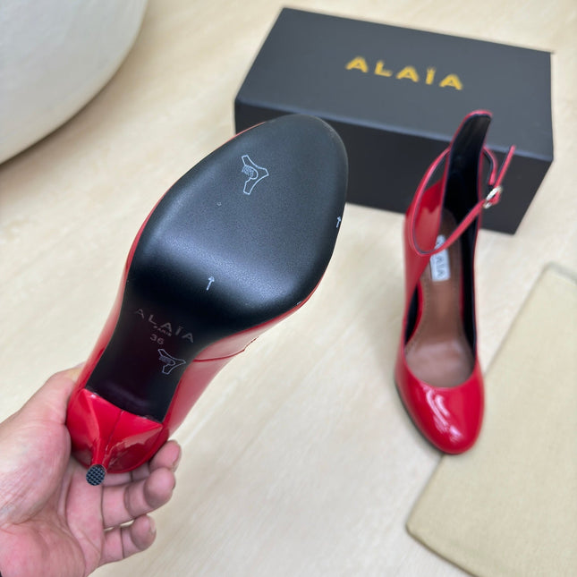 DECOLLETE PUMPS IN CHERRY RED PATENT CALFSKIN