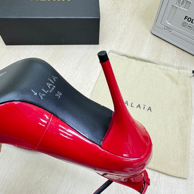 DECOLLETE PUMPS IN CHERRY RED PATENT CALFSKIN