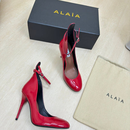 DECOLLETE PUMPS IN CHERRY RED PATENT CALFSKIN