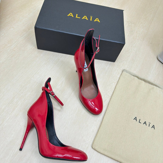 DECOLLETE PUMPS IN CHERRY RED PATENT CALFSKIN