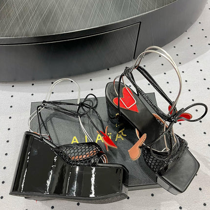 ALAIA BANQUET WEDGE SANDALS IN BLACK LAMBSKIN WITH RED HEART