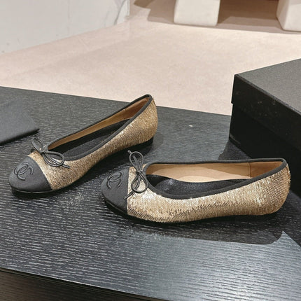 BALLET FLATS IN GOLDEN GLITTERED TULLE AND BLACK SATIN