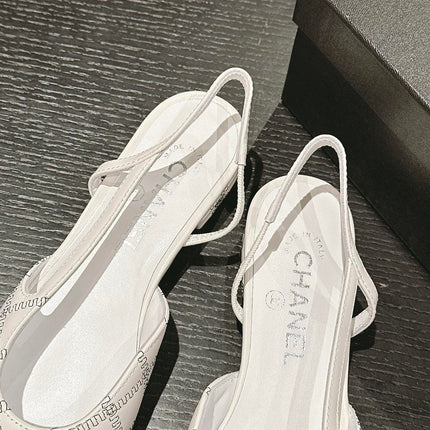 SLINGBACKS IN WHITE LAMBSKIN AND BLACK SATIN