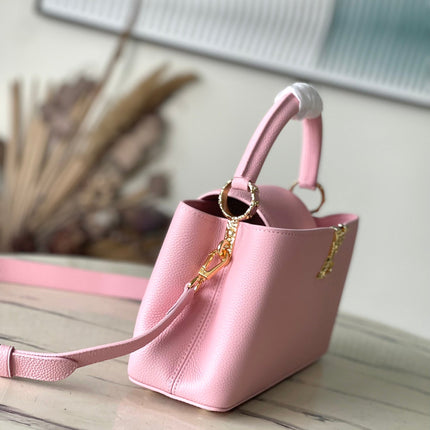 CAPUCINES EAST-WEST 33 IN BLUSH PINK CALFSKIN GOLD HARDWARE