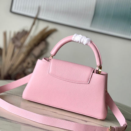 CAPUCINES EAST-WEST 33 IN BLUSH PINK CALFSKIN GOLD HARDWARE