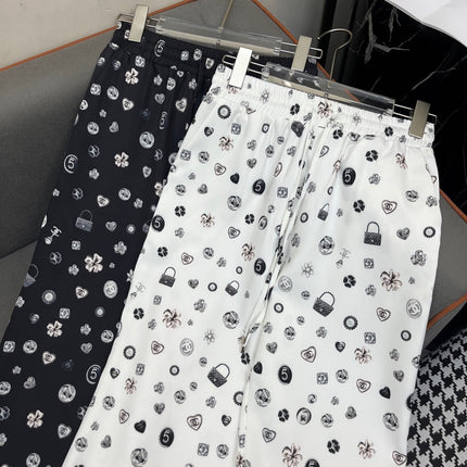ALL-OVER LOGO PRINTED PANTS WITH STRETCH WAIST