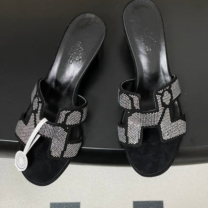 HM 25S ORAN HIGH‑HEEL SANDAL 50 MM IN BLACK LAMBSKIN WITH WHITE STONE DETAILS