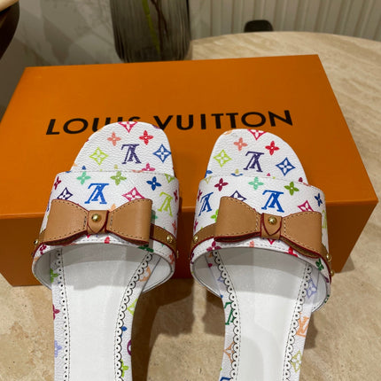 FLAT MULES IN WHITE MONOGRAM LAMBSKIN