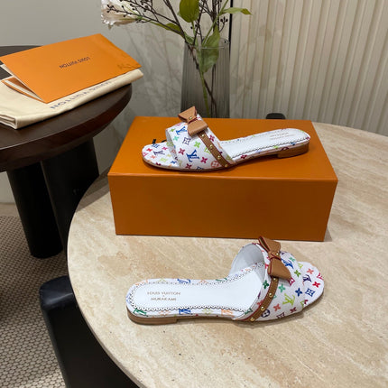 FLAT MULES IN WHITE MONOGRAM LAMBSKIN