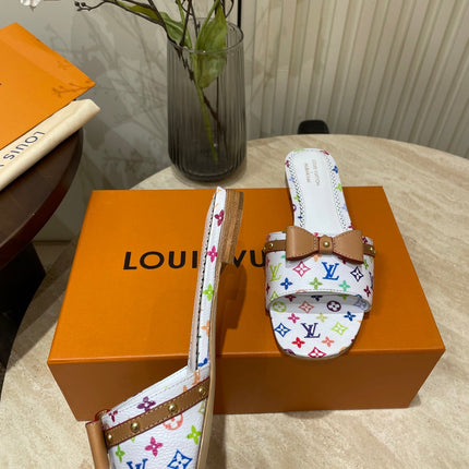 FLAT MULES IN WHITE MONOGRAM LAMBSKIN