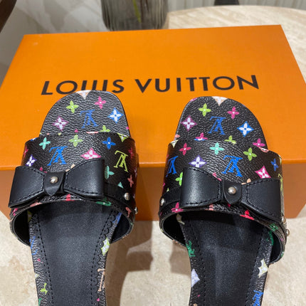 BOW FLAT MULES IN BLACK MONOGRAM LAMBSKIN