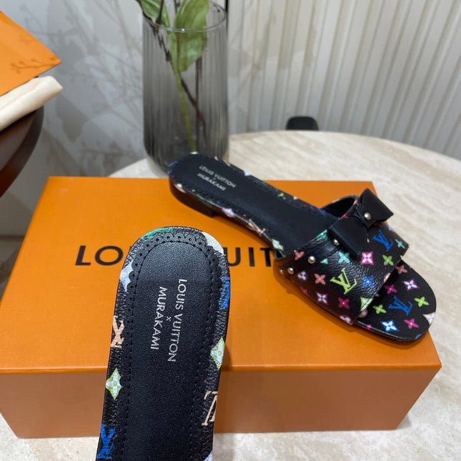 BOW FLAT MULES IN BLACK MONOGRAM LAMBSKIN