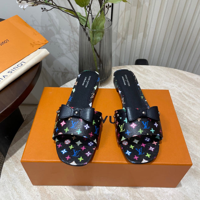 BOW FLAT MULES IN BLACK MONOGRAM LAMBSKIN