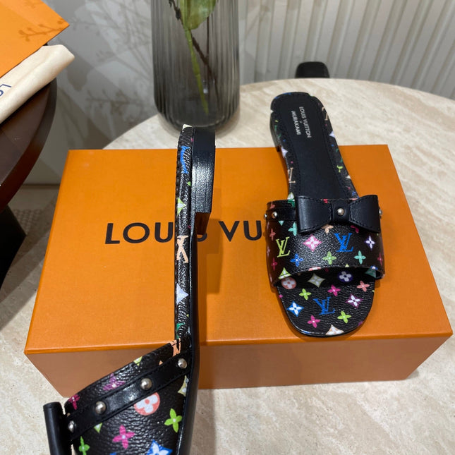 BOW FLAT MULES IN BLACK MONOGRAM LAMBSKIN