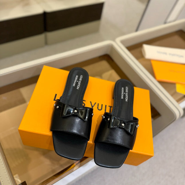 LV X TM 6AM FLAT MULE IN BLACK CALFSKIN