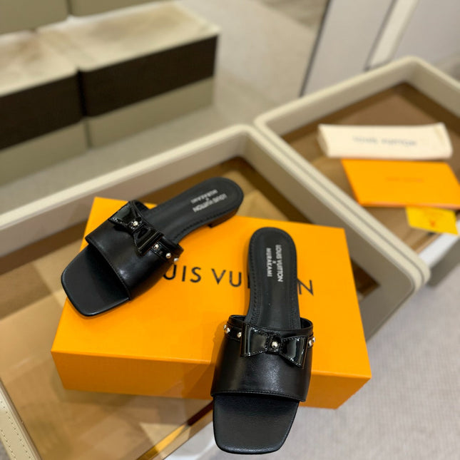 LV X TM 6AM FLAT MULE IN BLACK CALFSKIN