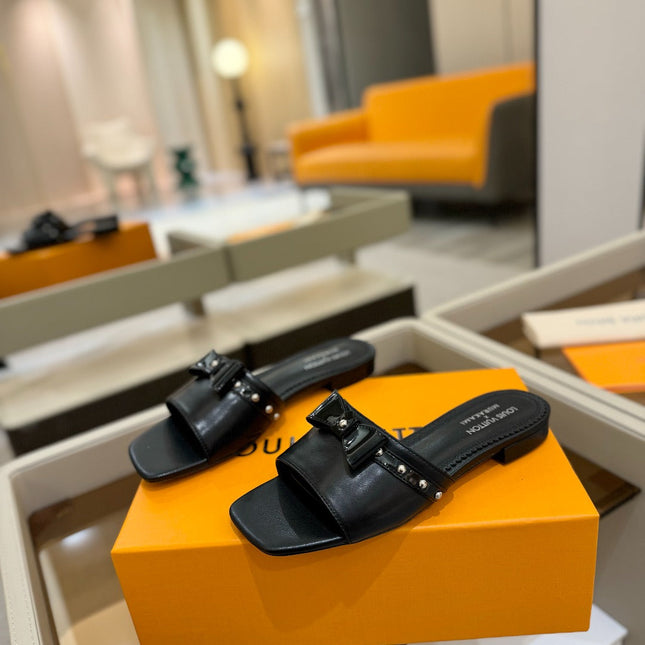 LV X TM 6AM FLAT MULE IN BLACK CALFSKIN