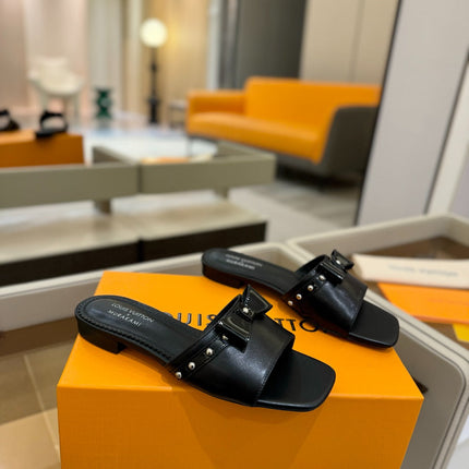 LV X TM 6AM FLAT MULE IN BLACK CALFSKIN