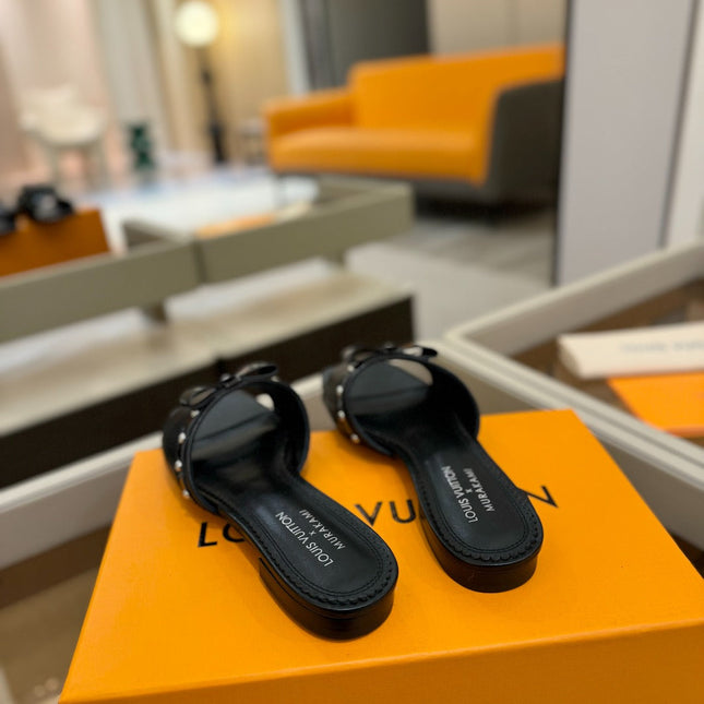 LV X TM 6AM FLAT MULE IN BLACK CALFSKIN
