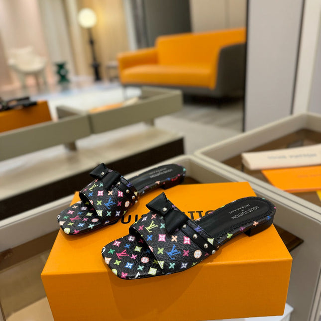 LV X TM 6AM FLAT MULE IN BLACK MONOGRAM CALFSKIN