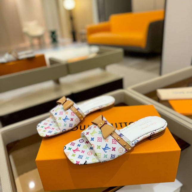 LV X TM 6AM FLAT MULE IN WHITE MONOGRAM CALFSKIN