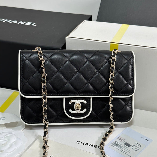 QUILTED FLAP BAG WITH WHITE TRIM 19 IN BLACK LAMBSKIN