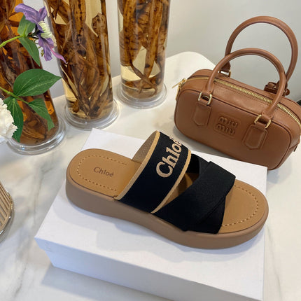WOODY WEDGE SANDALS IN BLACK CANVAS WITH CIDER BROWN RUBBER SOLE