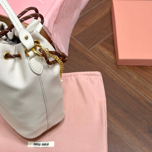 DRAWSTRING BUCKET BAG 21 IN WHITE CANVAS GOLD HARDWARE