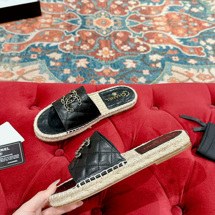 FLAT SLIPPERS IN BLACK LAMBSKIN AND WOVEN WITH LOGO