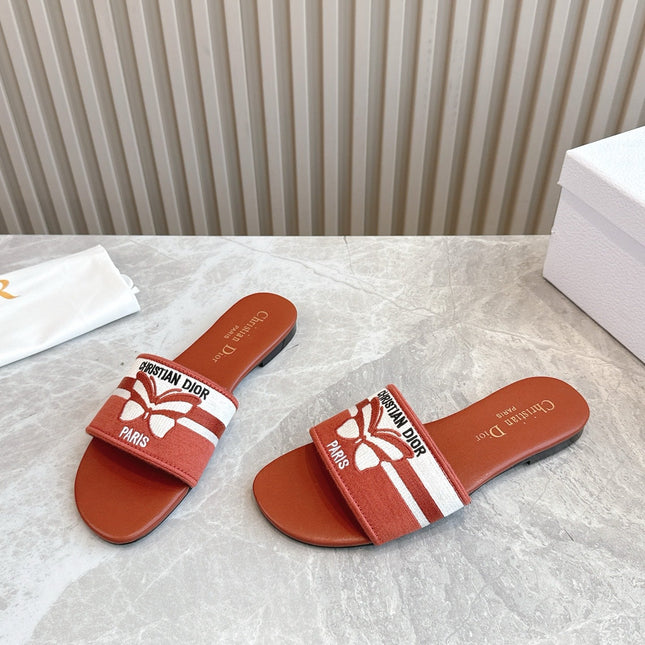 DIOR FLAT SLIDES 25S IN DARK ORANGE CALFSKIN AND FABRIC BRAND NAME EMBROIDERY