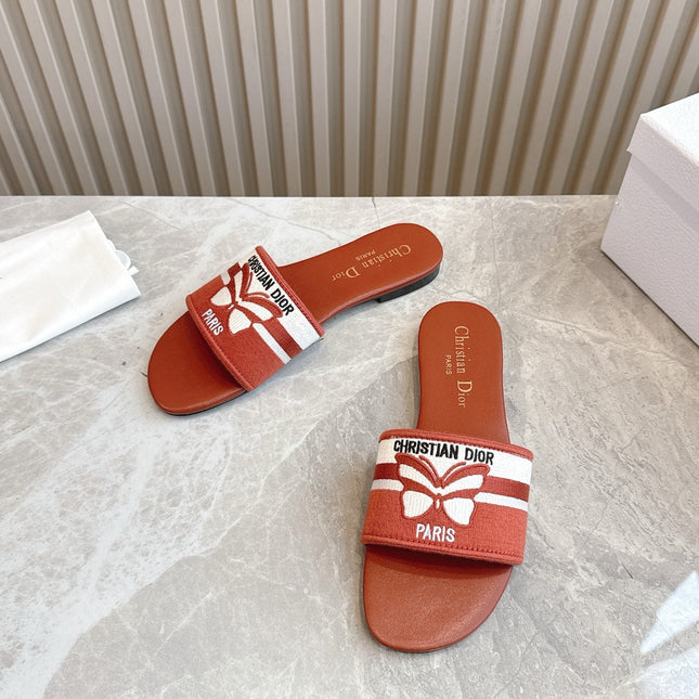 DIOR FLAT SLIDES 25S IN DARK ORANGE CALFSKIN AND FABRIC BRAND NAME EMBROIDERY