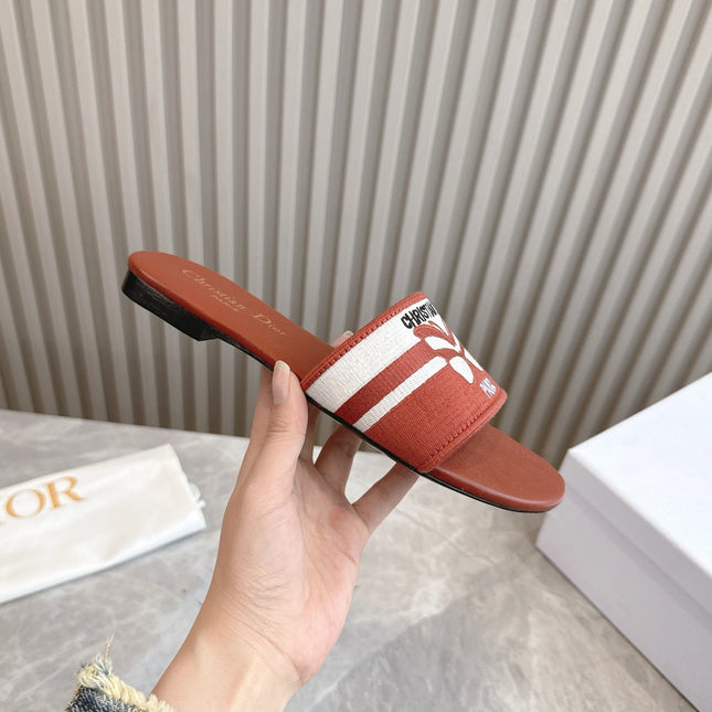 DIOR FLAT SLIDES 25S IN DARK ORANGE CALFSKIN AND FABRIC BRAND NAME EMBROIDERY