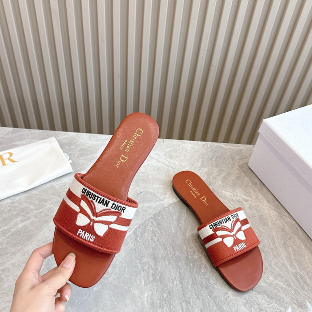 DIOR FLAT SLIDES 25S IN DARK ORANGE CALFSKIN AND FABRIC BRAND NAME EMBROIDERY