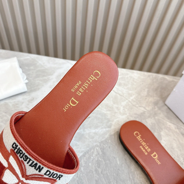 DIOR FLAT SLIDES 25S IN DARK ORANGE CALFSKIN AND FABRIC BRAND NAME EMBROIDERY