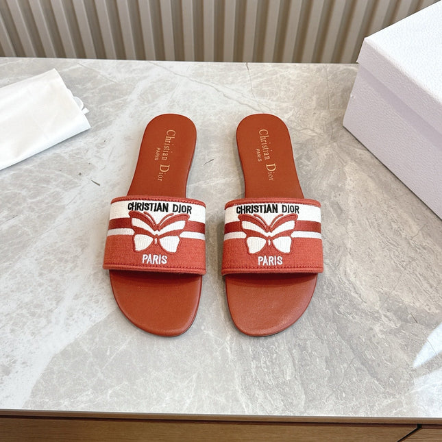 DIOR FLAT SLIDES 25S IN DARK ORANGE CALFSKIN AND FABRIC BRAND NAME EMBROIDERY