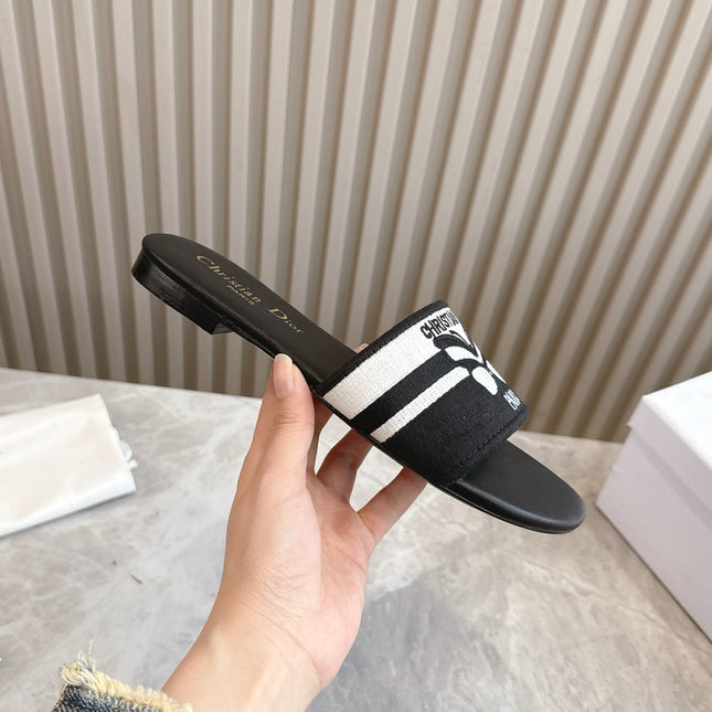 DIOR FLAT SLIDES 25S IN BLACK CALFSKIN AND FABRIC BRAND NAME EMBROIDERY