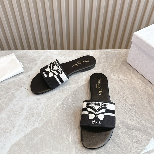 DIOR FLAT SLIDES 25S IN BLACK CALFSKIN AND FABRIC BRAND NAME EMBROIDERY