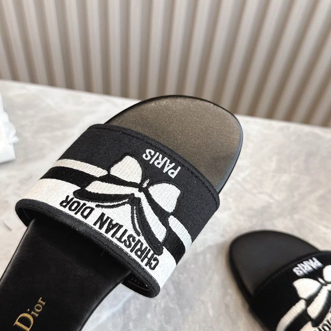 DIOR FLAT SLIDES 25S IN BLACK CALFSKIN AND FABRIC BRAND NAME EMBROIDERY