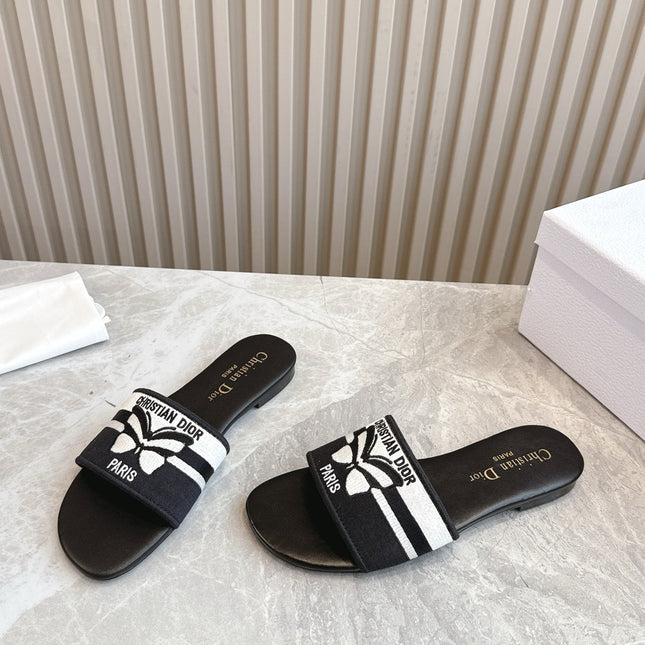 DIOR FLAT SLIDES 25S IN BLACK CALFSKIN AND FABRIC BRAND NAME EMBROIDERY