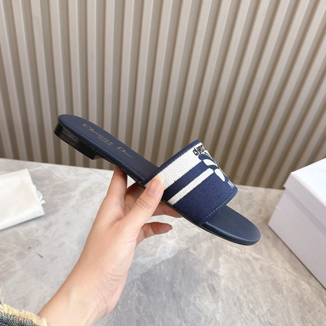 DIOR FLAT SLIDES 25S IN MIDNIGHT BLUE CALFSKIN AND FABRIC EMBROIDERED BUTTERFLY MOTIF