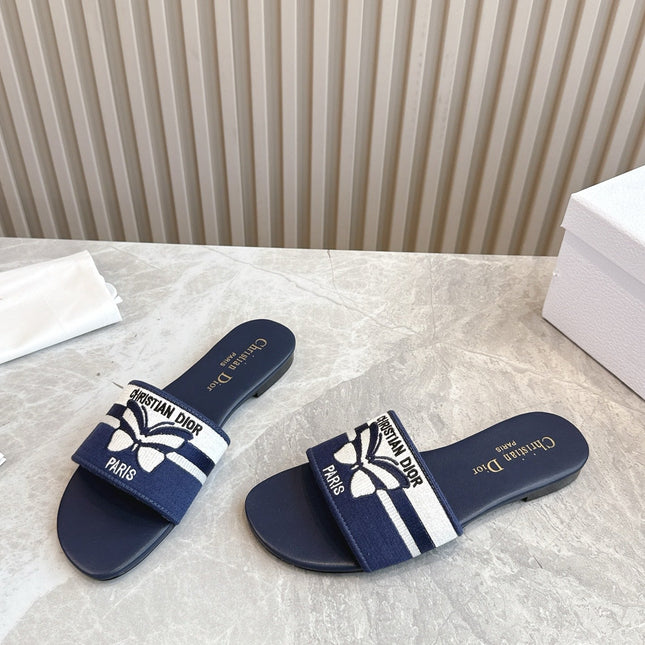 DIOR FLAT SLIDES 25S IN MIDNIGHT BLUE CALFSKIN AND FABRIC EMBROIDERED BUTTERFLY MOTIF