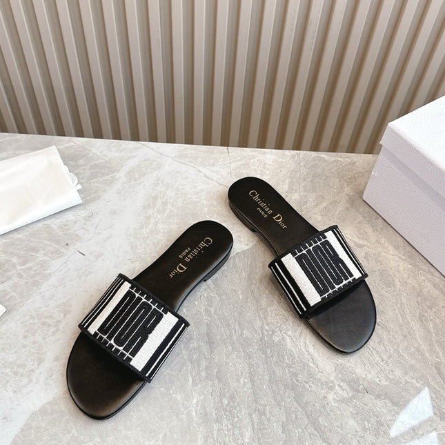 DIOR FLAT SLIDES 25S IN BLACK CALFSKIN AND FABRIC BRAND NAME EMBROIDERY