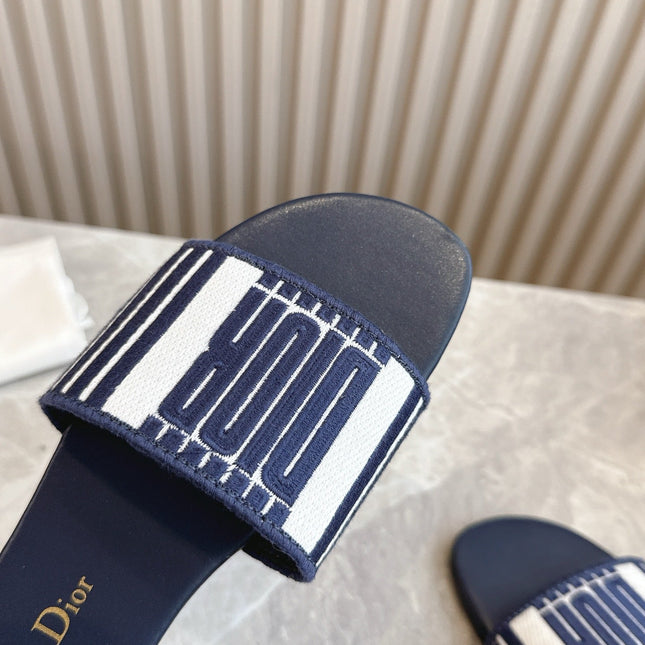 DIOR FLAT SLIDES 25S IN MIDNIGHT BLUE CALFSKIN AND FABRIC BRAND NAME EMBROIDERY