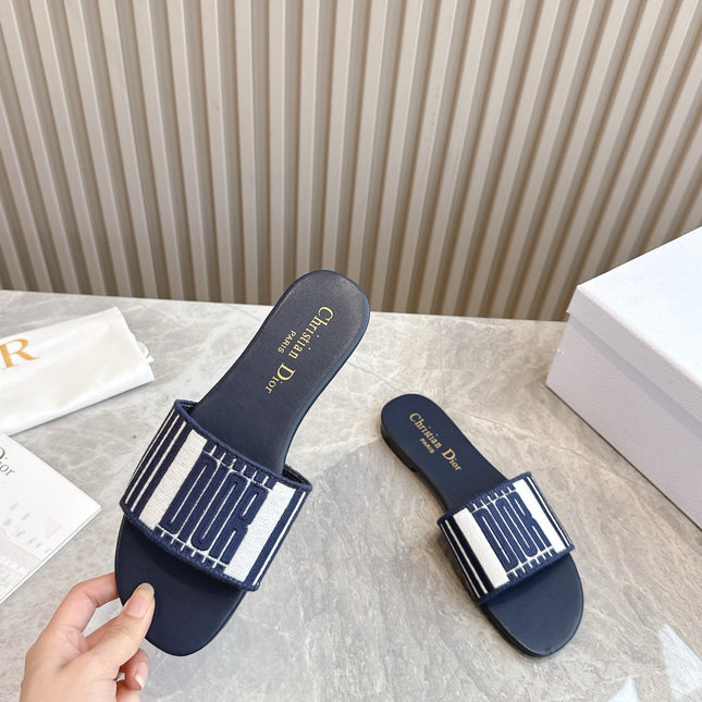 DIOR FLAT SLIDES 25S IN MIDNIGHT BLUE CALFSKIN AND FABRIC BRAND NAME EMBROIDERY