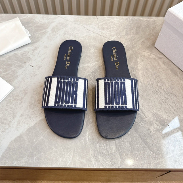 DIOR FLAT SLIDES 25S IN MIDNIGHT BLUE CALFSKIN AND FABRIC BRAND NAME EMBROIDERY