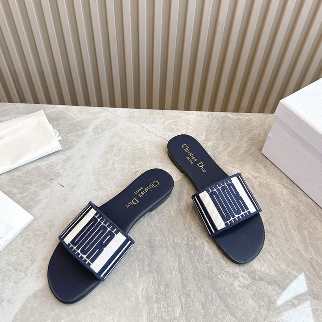DIOR FLAT SLIDES 25S IN MIDNIGHT BLUE CALFSKIN AND FABRIC BRAND NAME EMBROIDERY